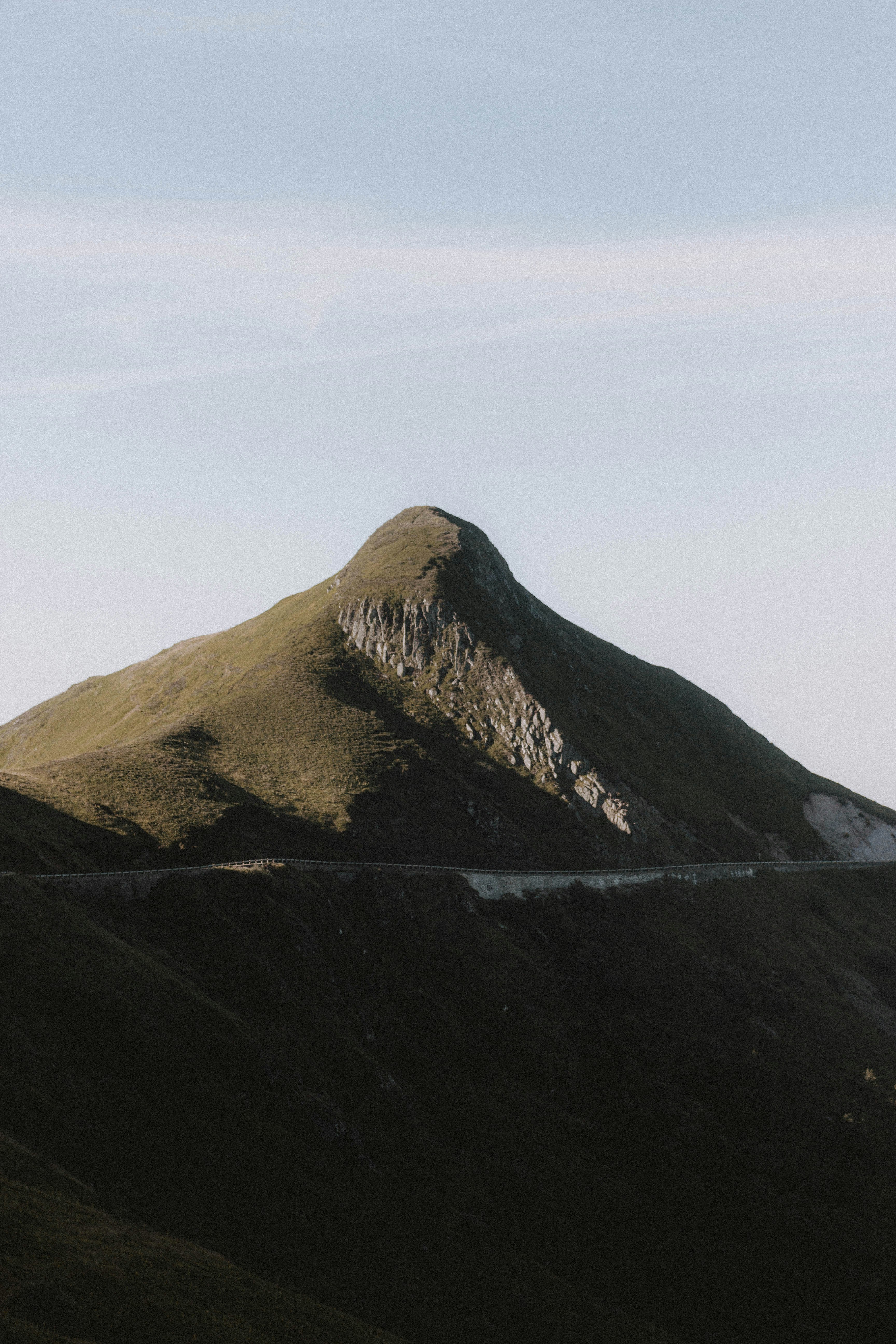 brown mountain under white sky during daytime